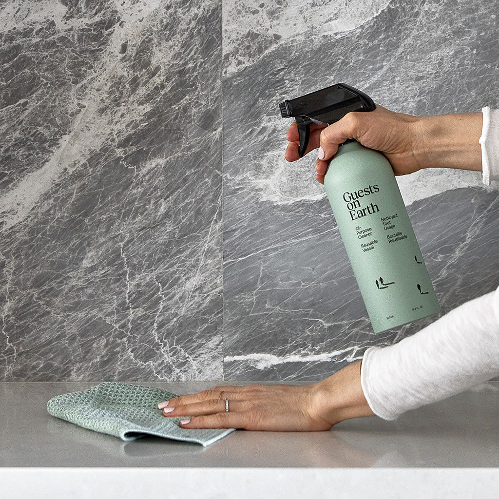 All purpose cleaner being used with microfiber cloths