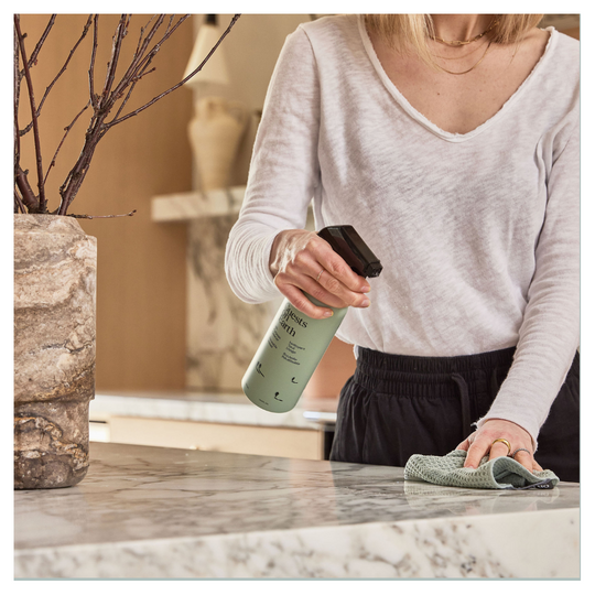 Cleaning marble kitchen island with Guests on Earth All-Purpose and safe cleaner