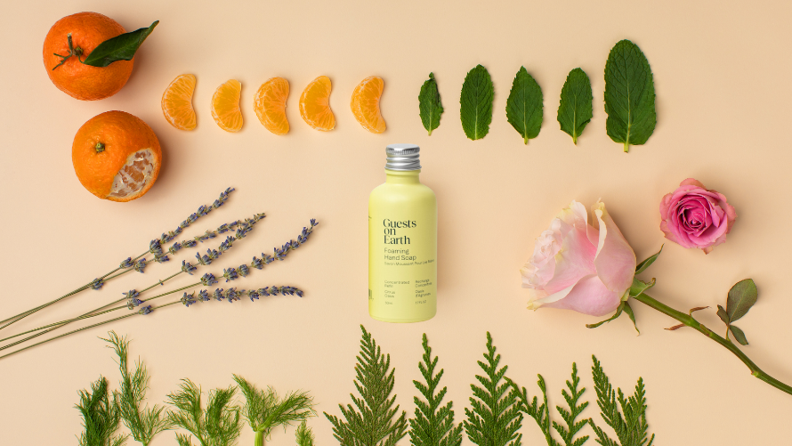 Guests on Earth Citrus Oasis foaming hand soap refill shown with tangerine, mint, lavender, rose, and greenery