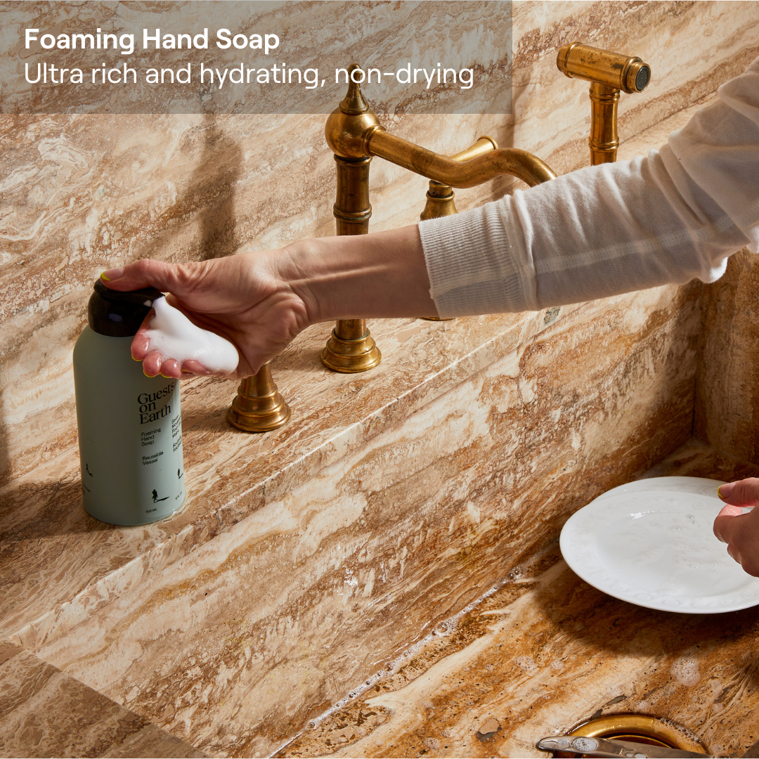 Guests on Earth Foaming Hand Soap in reusable bottle by sink for gentle, fresh handwashing