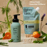 Guests on Earth foaming hand soap and bulk refill in a bright Citrus Oasis essential oil blend product display.