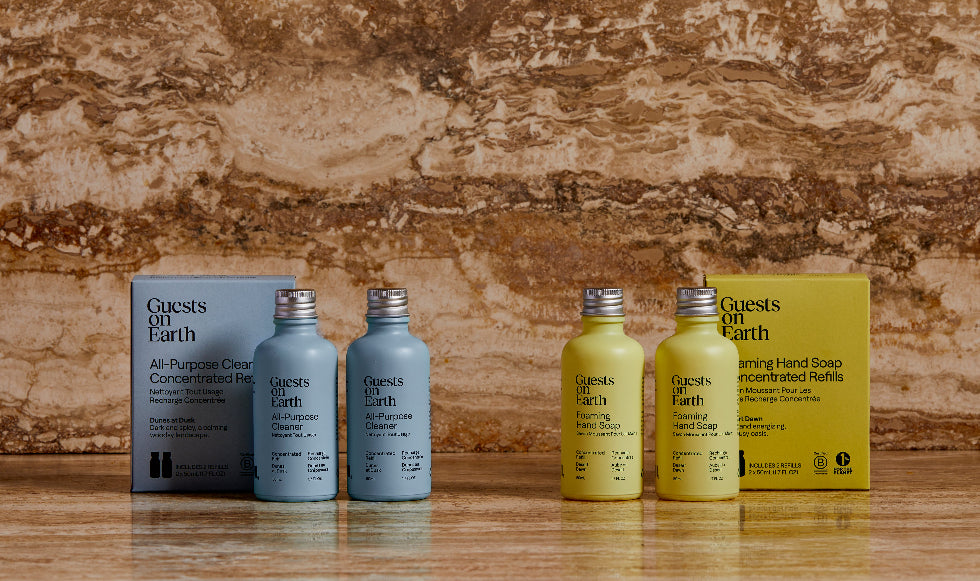 Guests on Earth refill sets: all-purpose cleaner and foaming hand soap concentrates in reusable bottles beside boxes